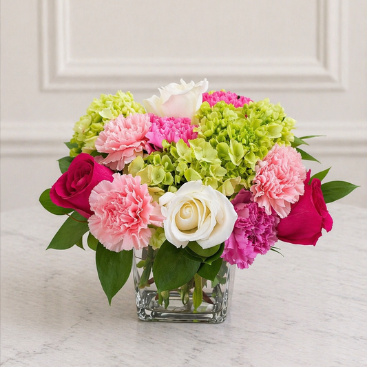 Hydrangea and rose floral arrangement in glass vase Toronto