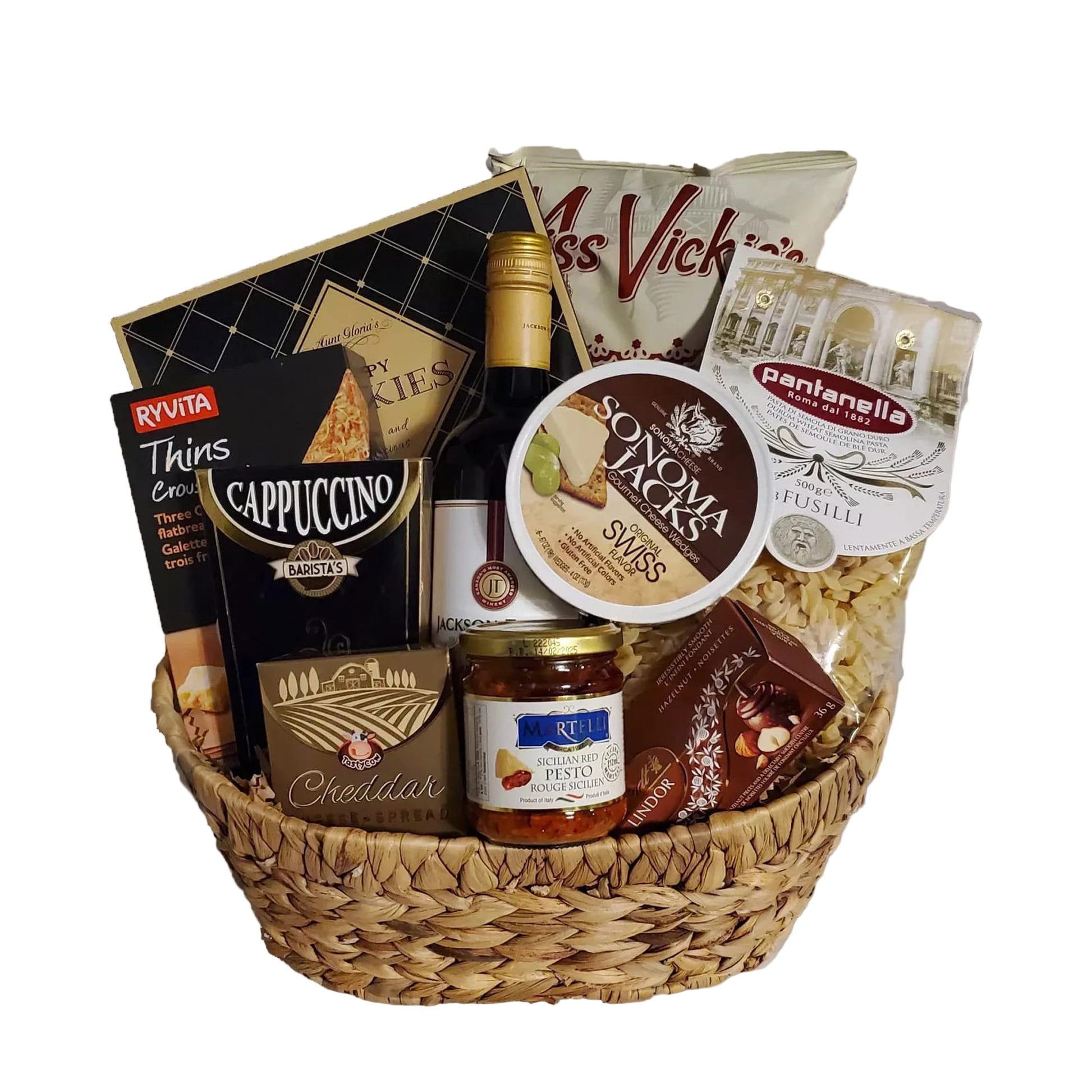 Chips, cookies, crackers and cheese in a wicker basket