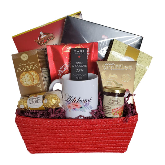 Red basket with mug biscuits and treats